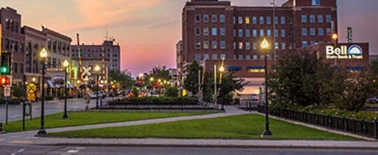 Broadway in downtown Fargo, North Dakota at dusk, near the Avenue Right office